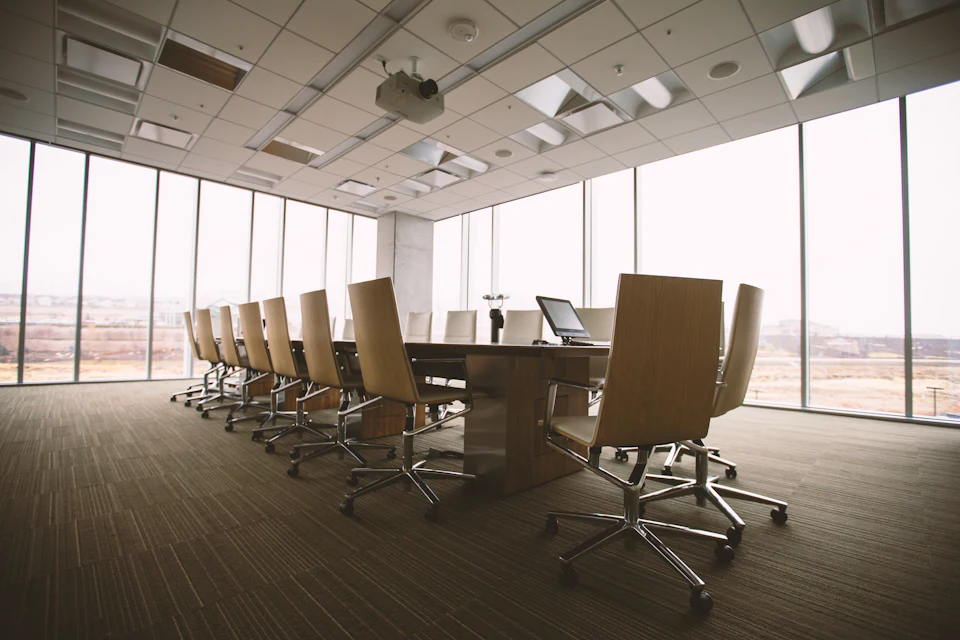 A corporate boardroom with floor-to-ceiling windows