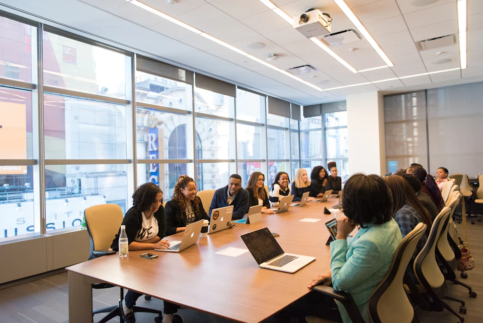 Executives meeting around a long boardroom table