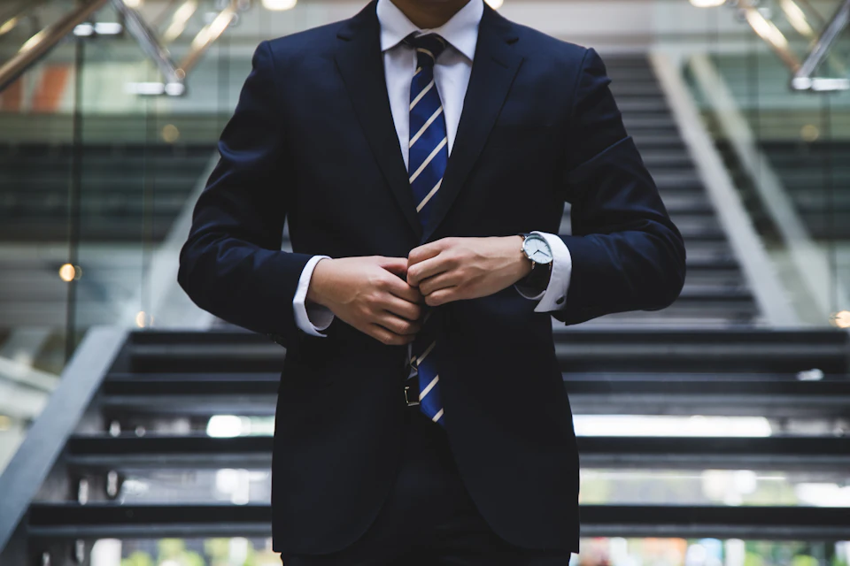 A business leader in a tailored suit